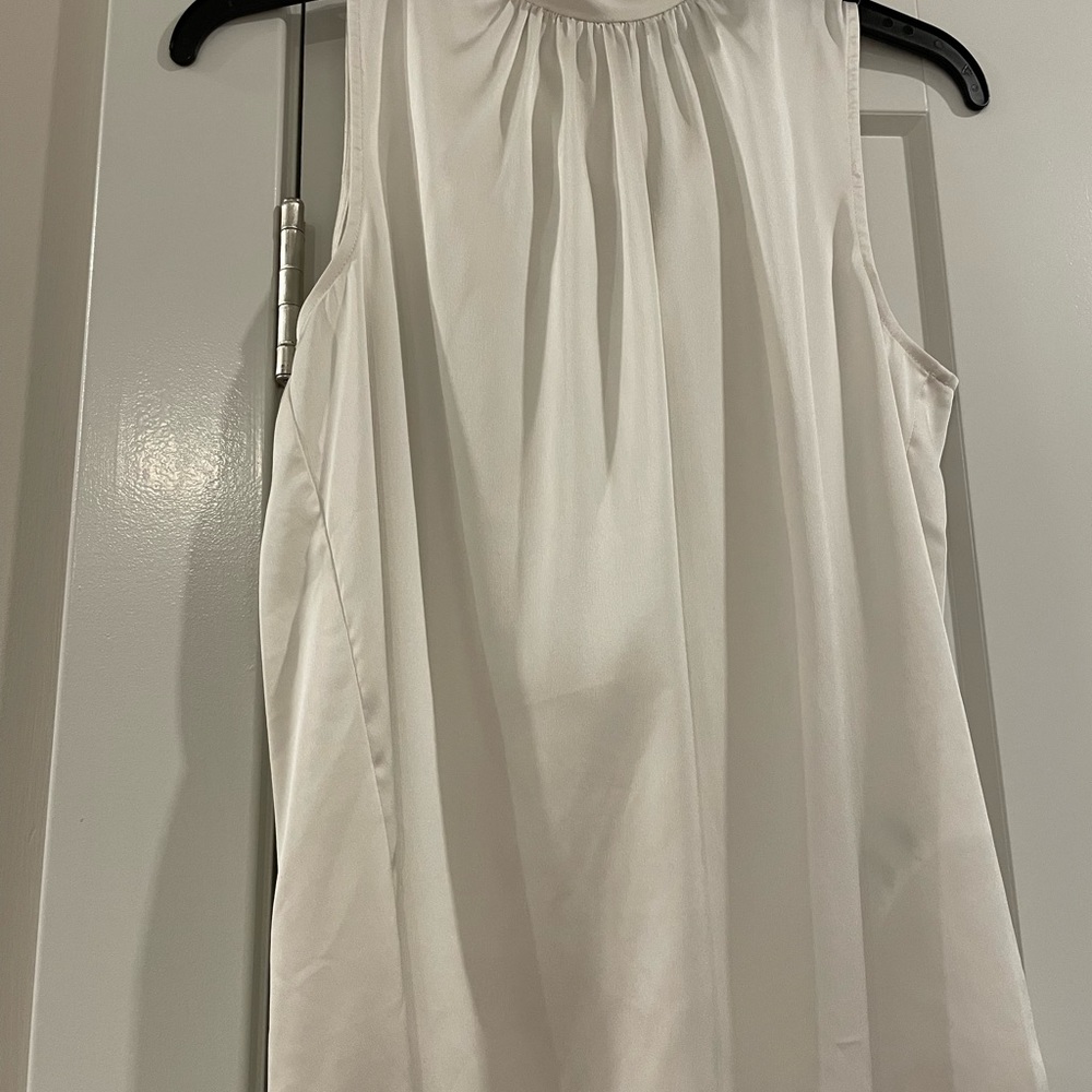 Sleeveless creme top with bow back